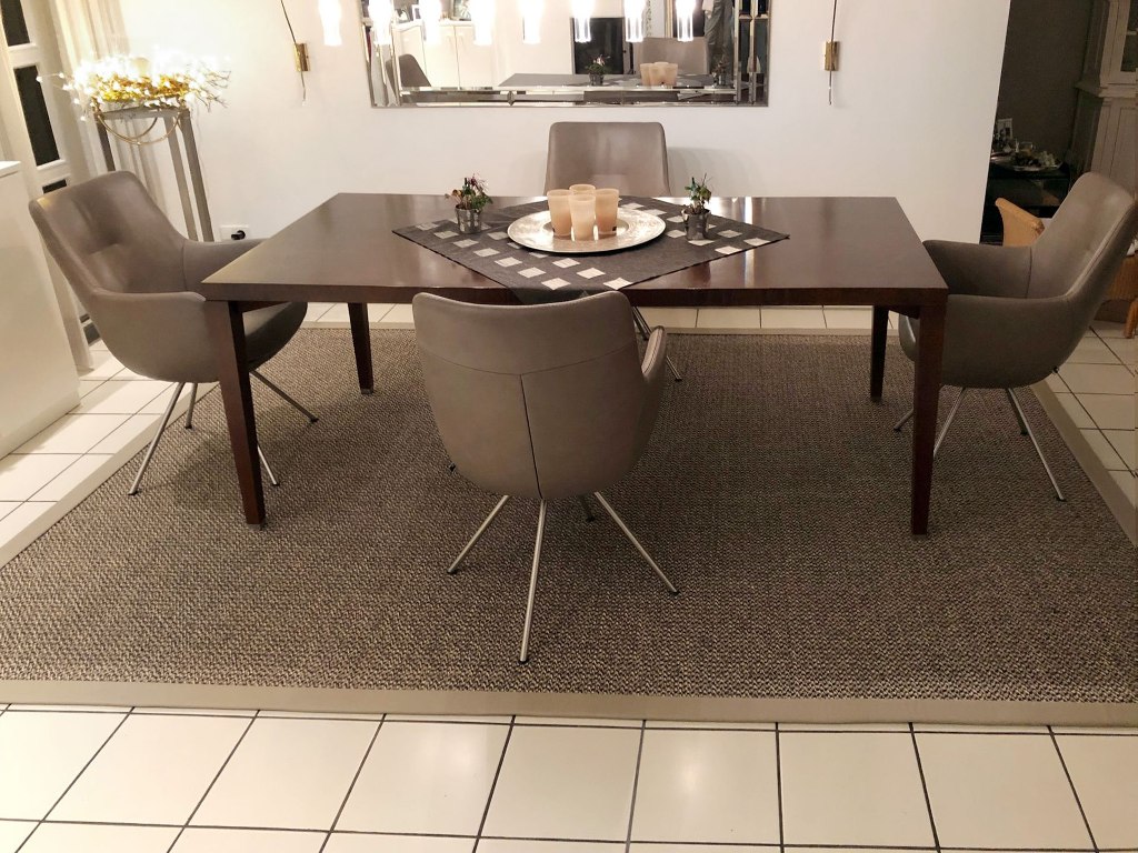 Photo of a custom-made rug under a customer's dining table.