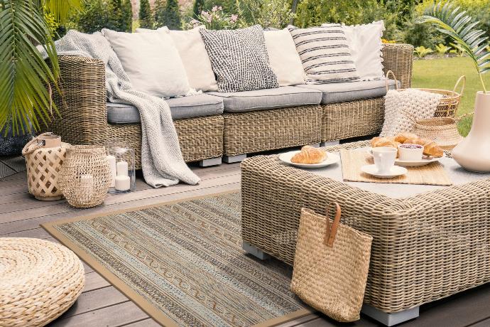 Photo of a Barbados sandy-beach outdoor rug on a porch.